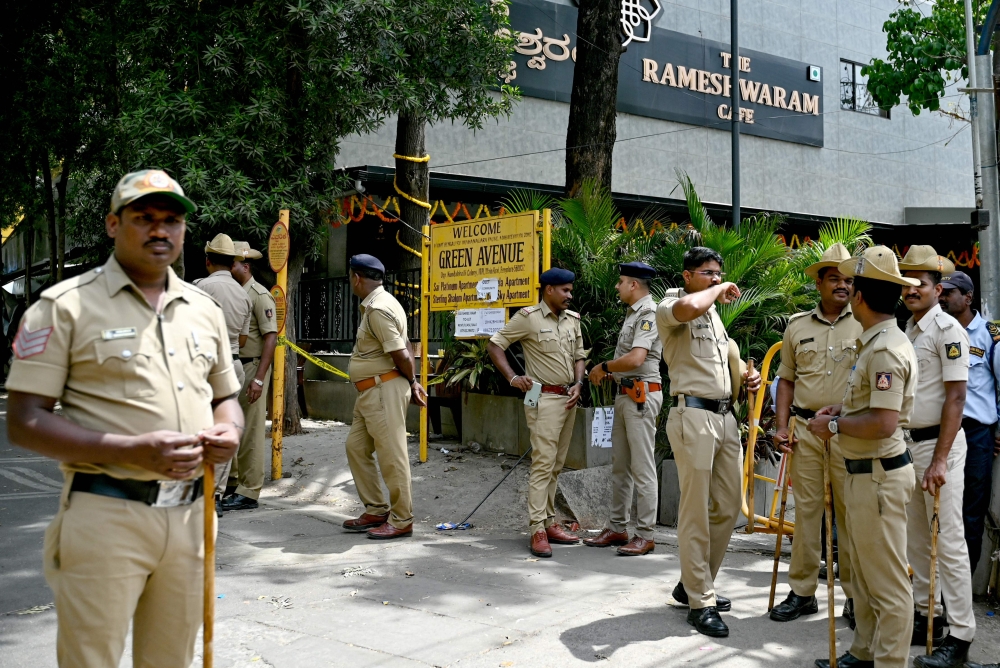 Police personnel stand guard in Bengaluru on March 2, 2024. — AFP pic