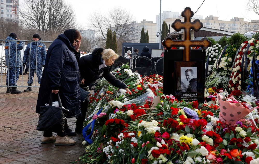Russian opposition leader Alexei Navalny and his widow Yulia Navalnaya’s mothers, Lyudmila and Alla, stand in front the grave of Alexei Navalny the day after the funeral at the Borisovskoye cemetery in Moscow, Russia, March 2, 2024. — Reuters pic
