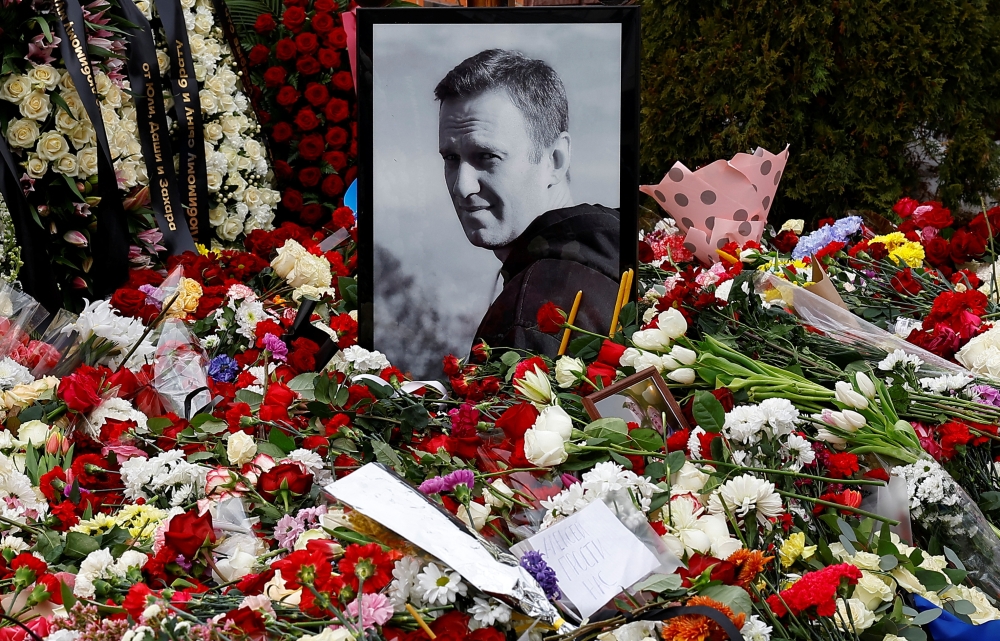 A portrait of Russian opposition politician Alexei Navalny is placed amid flowers at his grave the day after the funeral at the Borisovskoye cemetery in Moscow, Russia, March 2, 2024. — Reuters pic