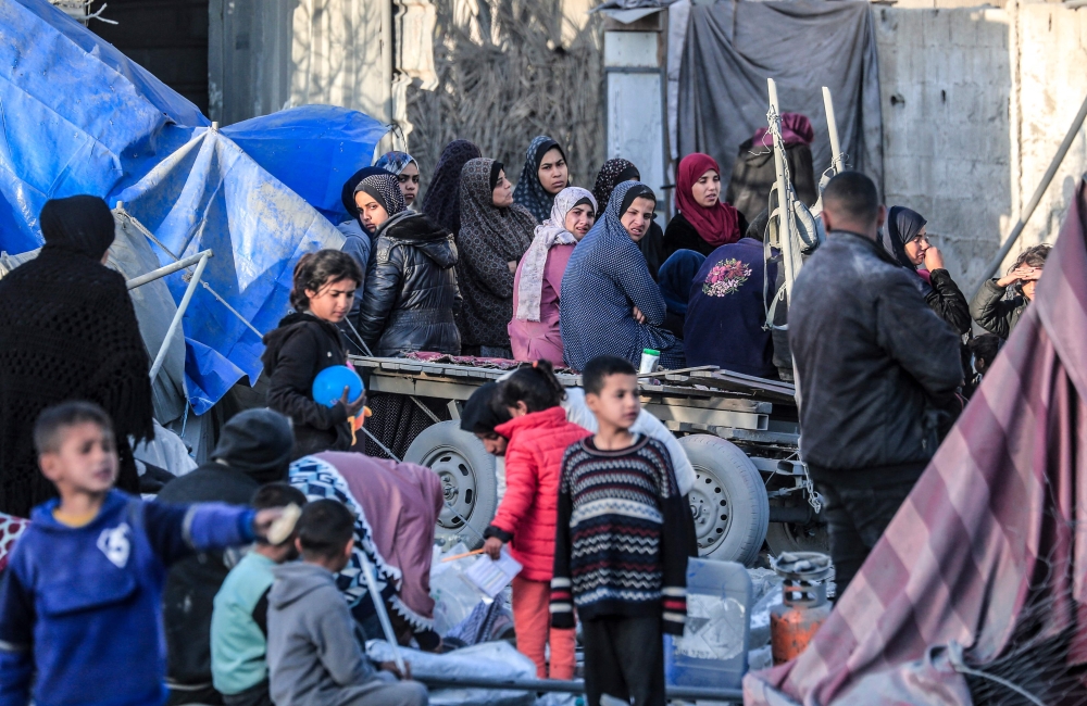 Palestinians look for salvageable items amid tents and makeshift shelters that were destroyed in Israeli strikes in Deir El-Balah in central Gaza on March 2, 2024, as battles continue between Israel and the militant group Hamas. — AFP pic