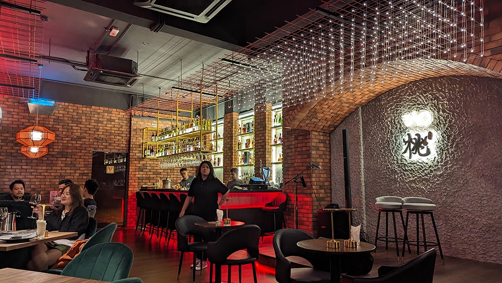 The interior at Táo includes a stage for live performances.