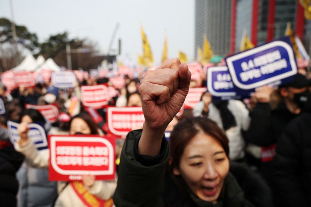Doctors during a rally to protest against government plans to increase medical school admissions in Seoul. — Reuters pic
