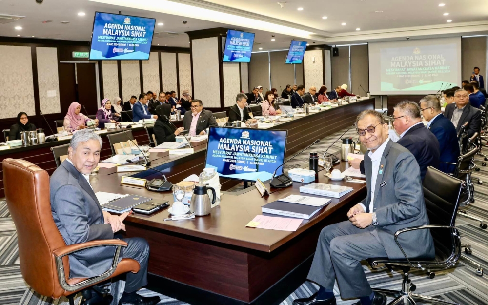 Deputy Prime Minister Datuk Seri Ahmad Zahid Hamidi chairs the ANMS Cabinet Committee meeting, March 4, 2024. With him is Health Minister Datuk Seri Dzulkefly Ahmad. — Picture from Facebook/Zahid Hamidi 