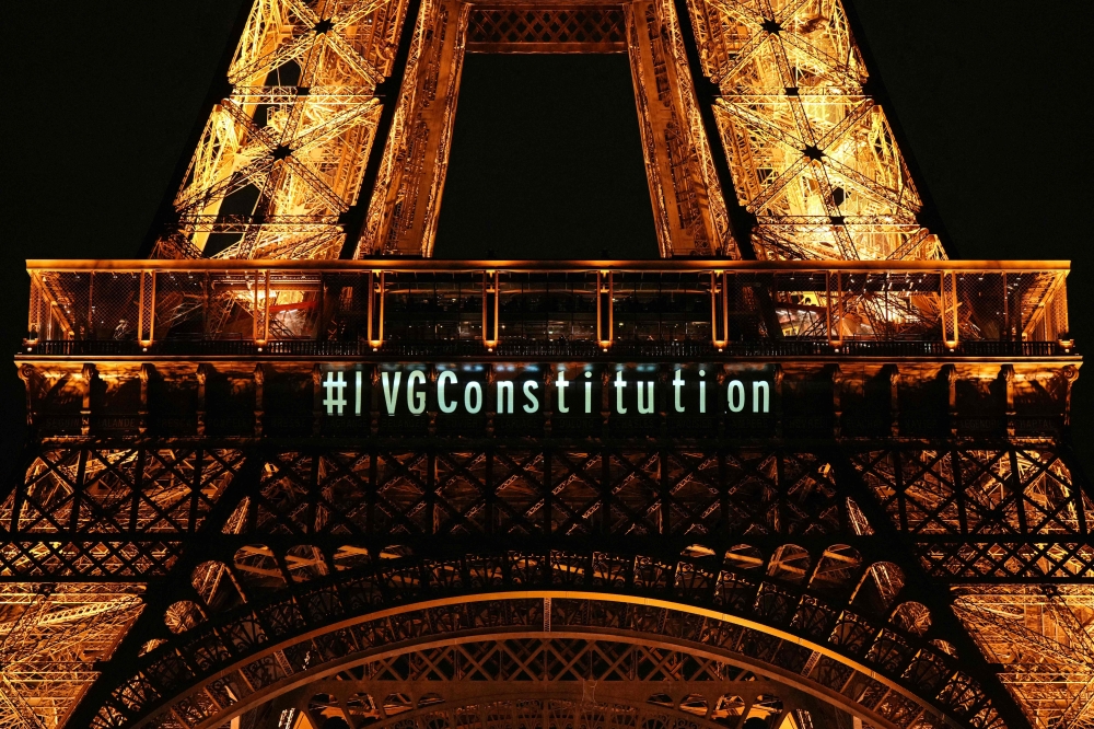 A message pertaining to abortion and the constitution is projected onto the Eiffel Tower after the French parliament voted to anchor the right to abortion in the country's constitution, in Paris, on March 4, 2024. ― AFP pic