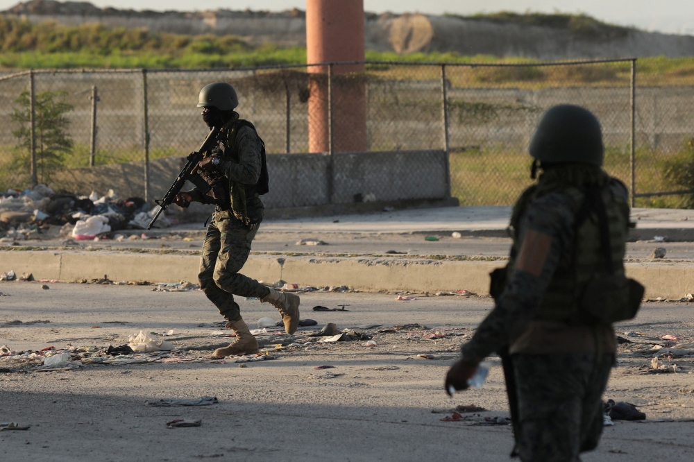 Haitian soldiers take positions outside the Toussaint Louverture International Airport following a gunfight with armed gangs on the surroundings of the airport, as the government declared state of emergency amid violence, in Port-au-Prince, Haiti March 4, 2024. ― Reuters pic