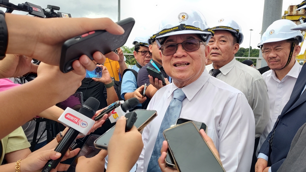 Deputy Premier Datuk Amar Douglas Uggah, speaking to reporters, says the amount of compensation to be paid by the state government for taking over Bintulu Port is still being worked out with the federal government, March 5, 2024. — Picture by Sulok Tawie
