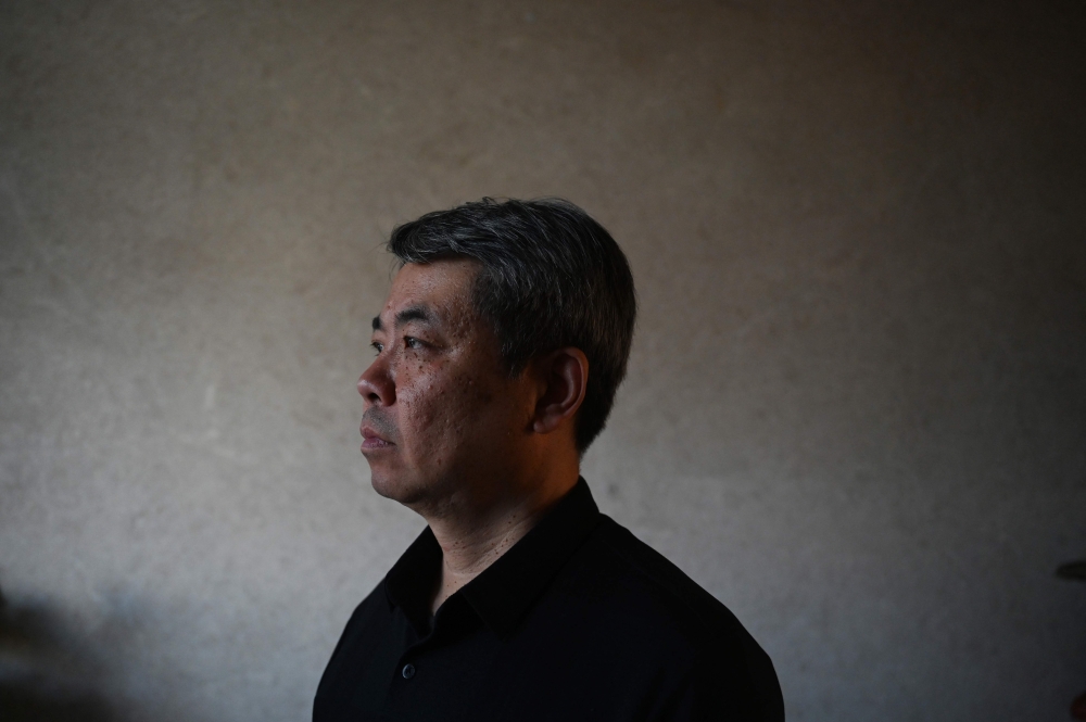 In this picture taken on February 29, 2024, Jiang Hui, whose mother was on board the missing Malaysia Airlines flight MH370, is seen at his home in Beijing. — AFP pic