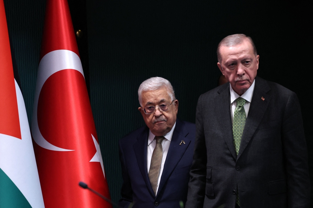 Turkish President Recep Tayyip Erdogan (right) listens as Palestinian leader Mahmud Abbas arrive for a meeting in Ankara, on March 5, 2024. — AFP pic