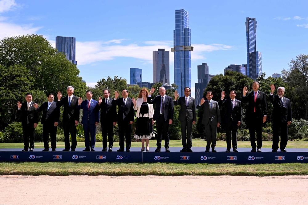 Leaders from South-east Asia and Australia post for a family photo at Government House during the 50th ASEAN-Australia Special Summit in Melbourne today. — AFP pic