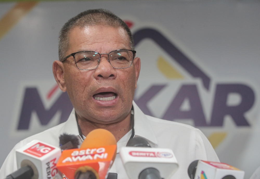 Home Minister Datuk Seri Saifuddin Nasution Ismail said so far there are about 13,000 undocumented immigrants in 19 immigration detention depots across the country. — Picture by Farhan Najib