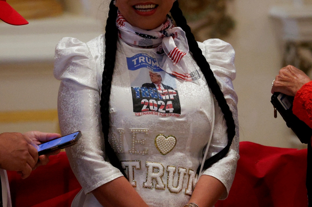 A supporter of Republican presidential candidate and former US President Donald Trump waits for him to arrive at a watch party event to mark the Super Tuesday primary elections at his Mar-a-Lago property, in Palm Beach, Florida March 5, 2024. — Reuters pic