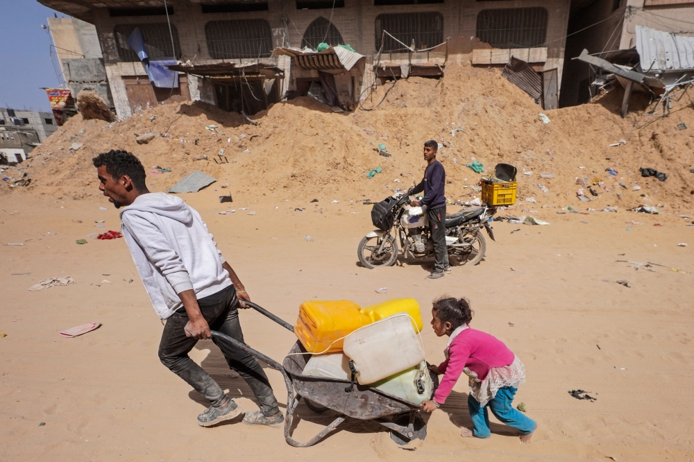 Dire shortages of food and water amid the devastating war have killed at least 18 people. — AFP pic