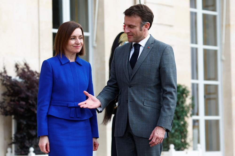 French President Emmanuel Macron receives Moldova's President Maia Sandu before a meeting at the Elysee Palace in Paris, France, March 7, 2024. — Reuters pic