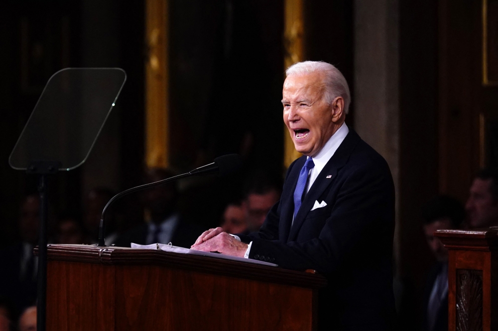 US President Joe Biden vowed yesterday he will not bow down to Russian leader Vladimir Putin, fiercely criticising rival Donald Trump in his State of the Union address. — AFP pic