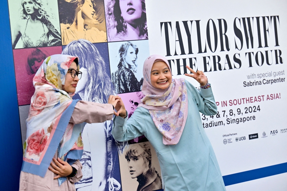 Taylor Swift's fans, or Swifties, pose for a picture at the National Stadium during Swift's Eras Tour concert in Singapore March 2, 2024. — Reuters pic  