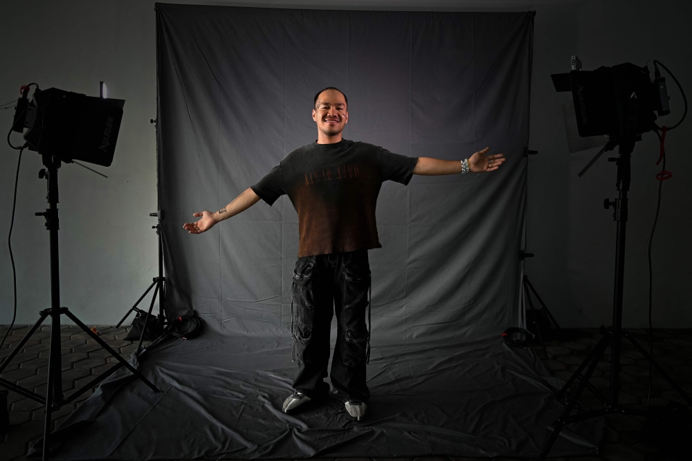 Renzo Gonzales from the Philippines, a fan of US singer Taylor Swift, also known as a Swiftie, poses for photos before the pop star's Eras Tour concert at the National Stadium in Singapore March 7, 2024. — AFP pic 