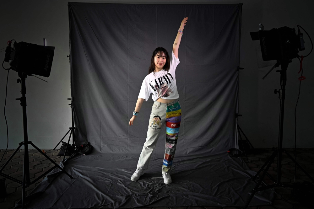 Sarah Lui from Hong Kong, a fan of US singer Taylor Swift, also known as a Swiftie, poses for photos before the pop star's Eras Tour concert at the National Stadium in Singapore March 7, 2024. — AFP pic 