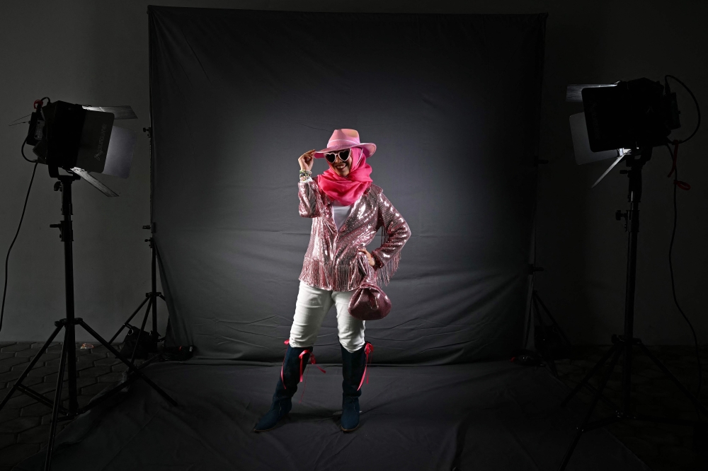 Nadia from Malaysia, a fan of US singer Taylor Swift, also known as a Swiftie, poses for photos before the pop star's Eras Tour concert at the National Stadium in Singapore March 7, 2024. — AFP pic 