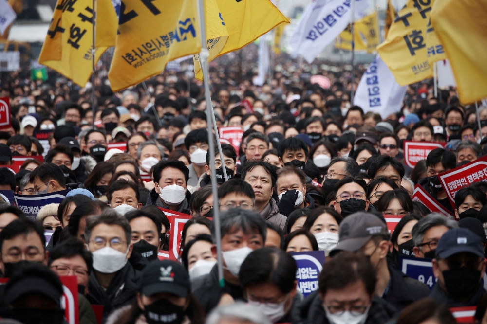 Doctors take part in a rally to protest against government plans to increase medical school admissions in Seoul March 3, 2024. — Reuters pic  