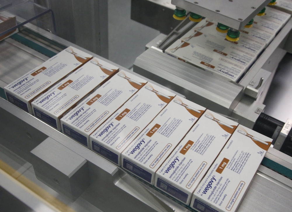 Boxes of Wegovy move along a packaging line at Novo Nordisk's facility in Hillerod, Denmark, March 8, 2024. ― Reuters pic