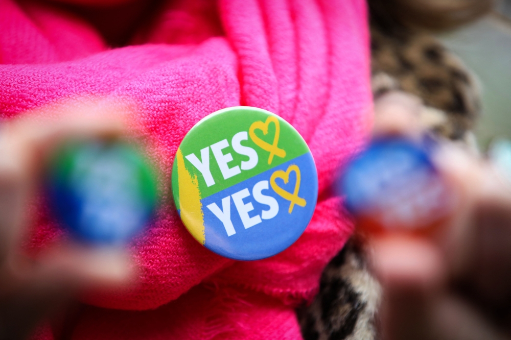 File photo of ‘Yes’ campaigners posing at a photo call organised by the National Women’s Council in Dublin, Ireland on March 5, 2024, ahead of the Irish Referendum. — AFP pic