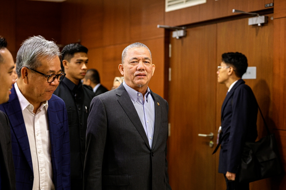 Deputy Prime Minister Datuk Seri Fadillah Yusof (centre) said the construction of a canal to divert water from Sungai Sarawak to Sungai Salak here is among the solutions suggested to solve flooding issues in Kuching. — Bernama pic