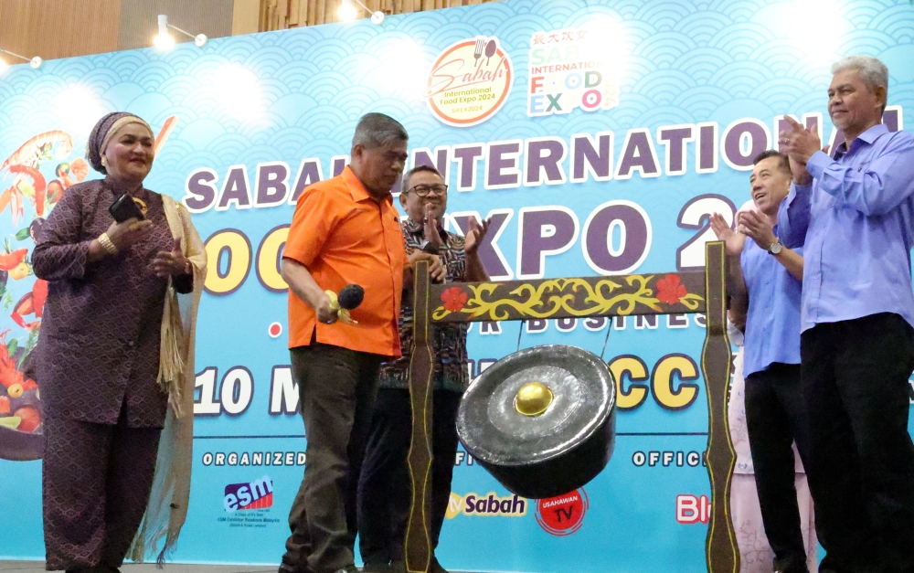 Agriculture and Food Security Minister Datuk Seri Mohamad Sabu (2nd left) officiates the Sabah International Food Expo 2024 at the Sabah International Convention Centre in Kota Kinabalu March 9, 2024. — Bernama pic