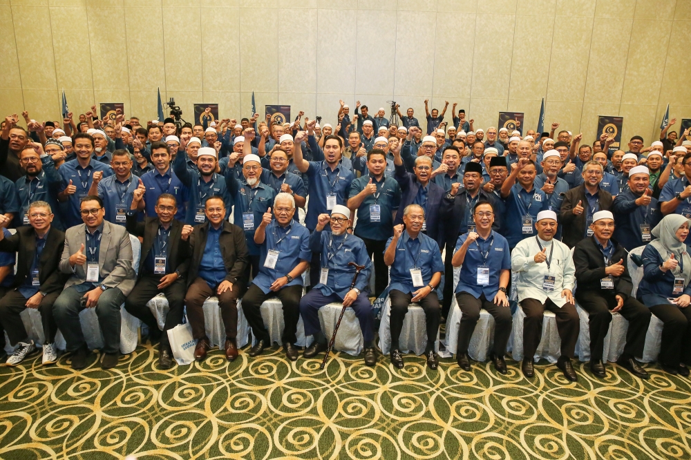 Perikatan Nasional chairman Tan Sri Muhyiddin Yassin (centre) and other PN leaders poses for a group picture during the 2024 Perikatan Nasional MPs and Assemblyman Convention at Sunway Putra Hotel in Kuala Lumpur March 9, 2024. Bersatu Youth chief Wan Ahmad Fayhsal Wan Kamal today said his party doubts Dewan Rakyat Speaker Tan Sri Johari Abdul will support its request to have six of its parliamentary seats declared vacant. — Picture by Yusof Mat Isa
