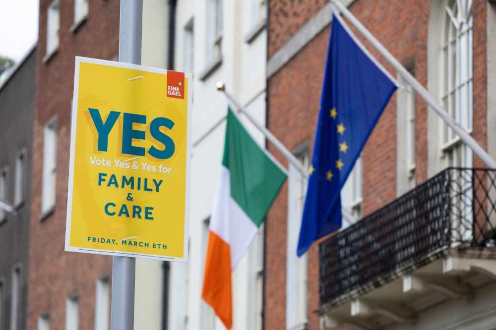 Signage is seen in relation to an upcoming 8th March referendum on changes to the Irish constitution called the Family Amendment and the Care Amendment, in Dublin, Ireland, March 3, 2024. — Reuters pic