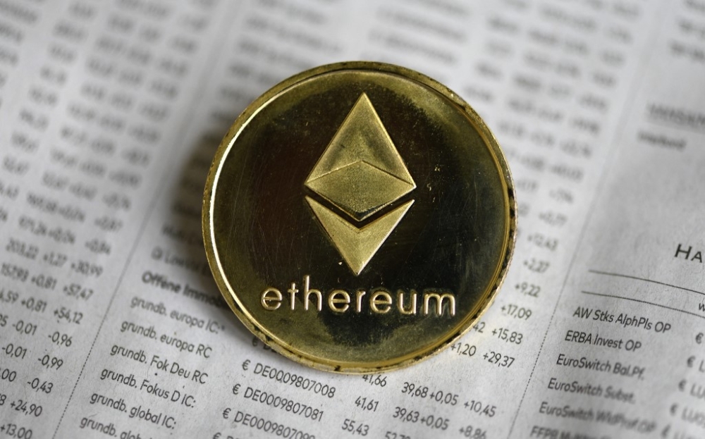 In this file photo taken on January 27, 2020, a physical imitation of a Ethereum cryptocurrency is seen in Dortmund, western Germany. Launched in 2015, Ether, also known as Ethereum, is by far the second-largest digital currency in terms of total value, now estimated at over US$460 billion (RM2.1 trillion). — AFP pic