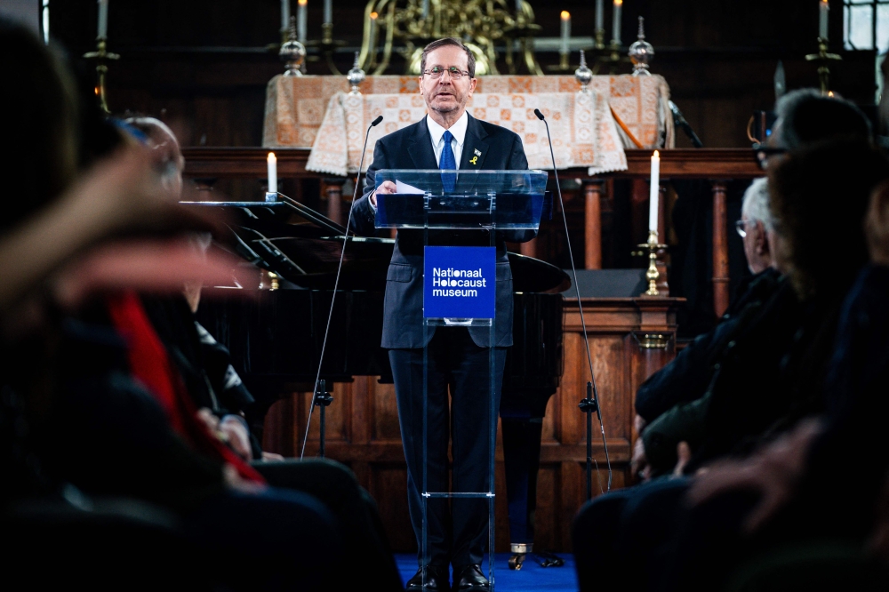 Israeli President Isaac Herzog (C) delivers a speech during an opening ceremony for the National Holocaust Museum, at the Portuguese Synagogue in Amsterdam, on March 10, 2024. — AFP pic