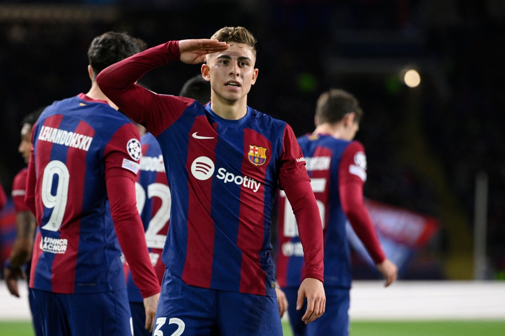 Barcelona's Spanish midfielder #32 Fermin Lopez celebrates scoring the opening goal during the Uefa Champions League last 16 second leg football match between FC Barcelona and SSC Napoli at the Estadi Olimpic Lluis Companys in Barcelona on March 12, 2024. — AFP pic