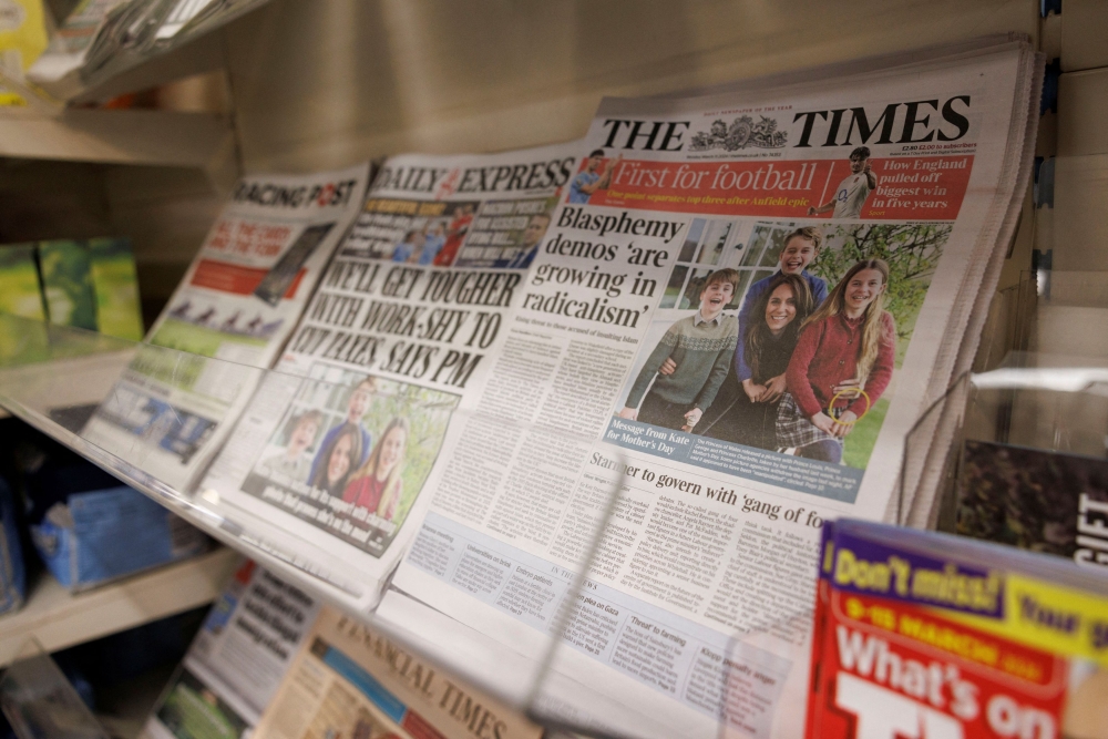Newspapers sit on a stand at a supermarket in London, Britain, March 11, 2024. — Reuters pic