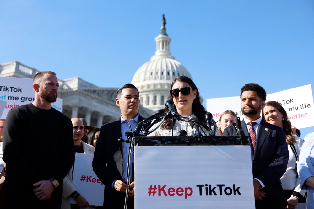 The US House of Representatives overwhelmingly approved a bill yesterday that would force TikTok to divest from its Chinese owner or be banned from the United States. — AFP pic