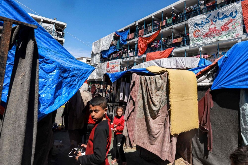 A camp sheltering displaced Palestinians in a school run by the United Nations Relief and Works Agency for Palestine Refugees (UNRWA) in Rafah. — AFP pic