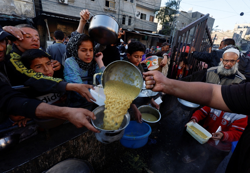 Israel will try to ‘flood’ the Gaza Strip with humanitarian aid from a variety of entry points, the main military spokesman said yesterday as international pressure mounted to address the growing problem of hunger in the besieged enclave. — Reuters pic