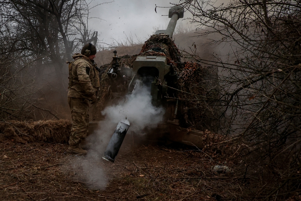 A Ukrainian serviceman of the 126th Separate Territorial Defence Brigade fires a D-30 howitzer towards Russian troops at a position in a front line, amid Russia's attack on Ukraine, in Kherson region, Ukraine March 12, 2024. — Radio Free Europe pic via Reuters