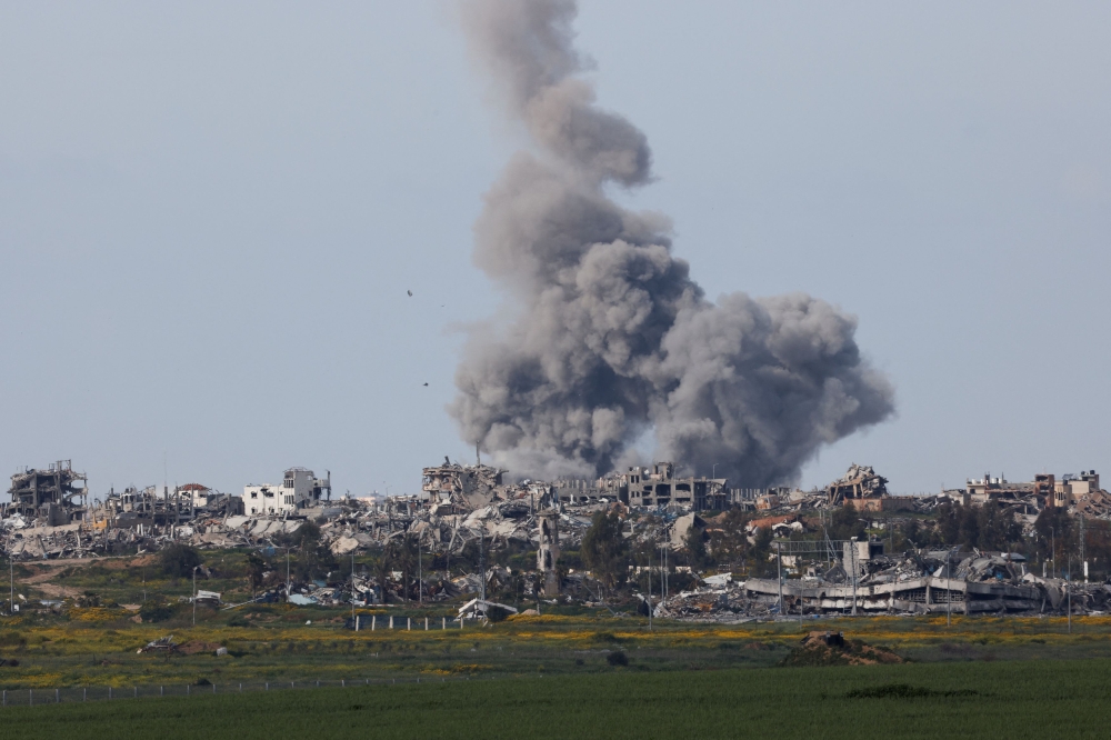 Smoke rises after an explosion in Gaza, amid the ongoing conflict between Israel and the Palestinian group Hamas, as seen from Israel, March 14, 2024. — Reuters pic