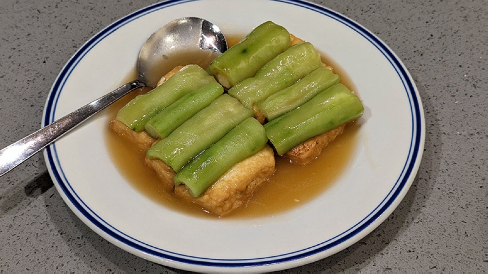 Signature Beancurd with Luffa Melon features smooth blocks of house-made egg beancurd and luffa covered in an appropriately velvety sauce