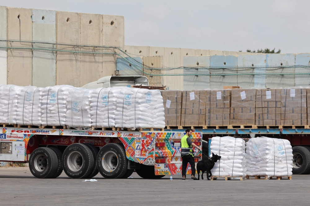 Aid workers say slow inspections and opaque rules on which items are allowed to enter Gaza have held up the arrival of aid. — AFP pic 