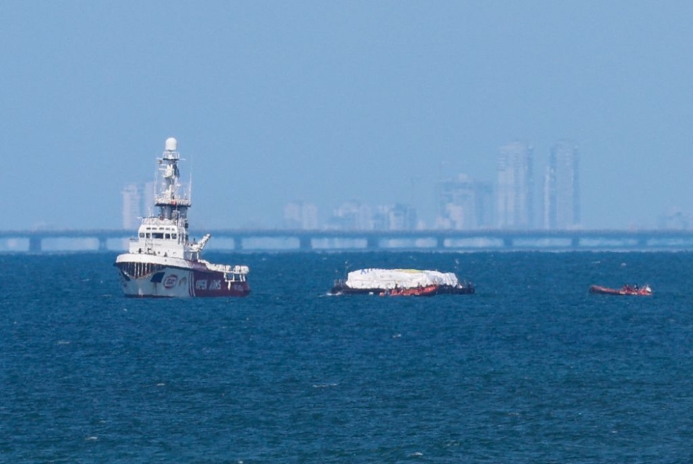 The Open Arms vessel carrying aid sails off the shore of Gaza, amid the ongoing conflict between Israel and the Palestinian Islamist group Hamas, as seen from central Gaza Strip, March 15, 2024. — Reuters pic