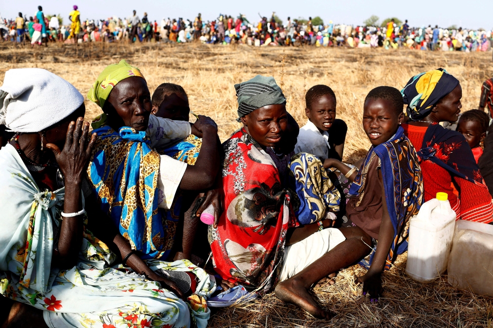 File photo of women and children waiting to be registered prior to a food distribution carried out by the United Nations World Food Programme (WFP) in Thonyor, Leer state, South Sudan, February 25, 2017. — Reuters pic