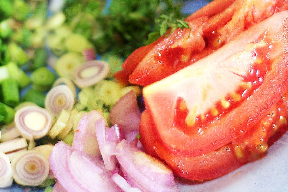 An assortment of sliced vegetables.