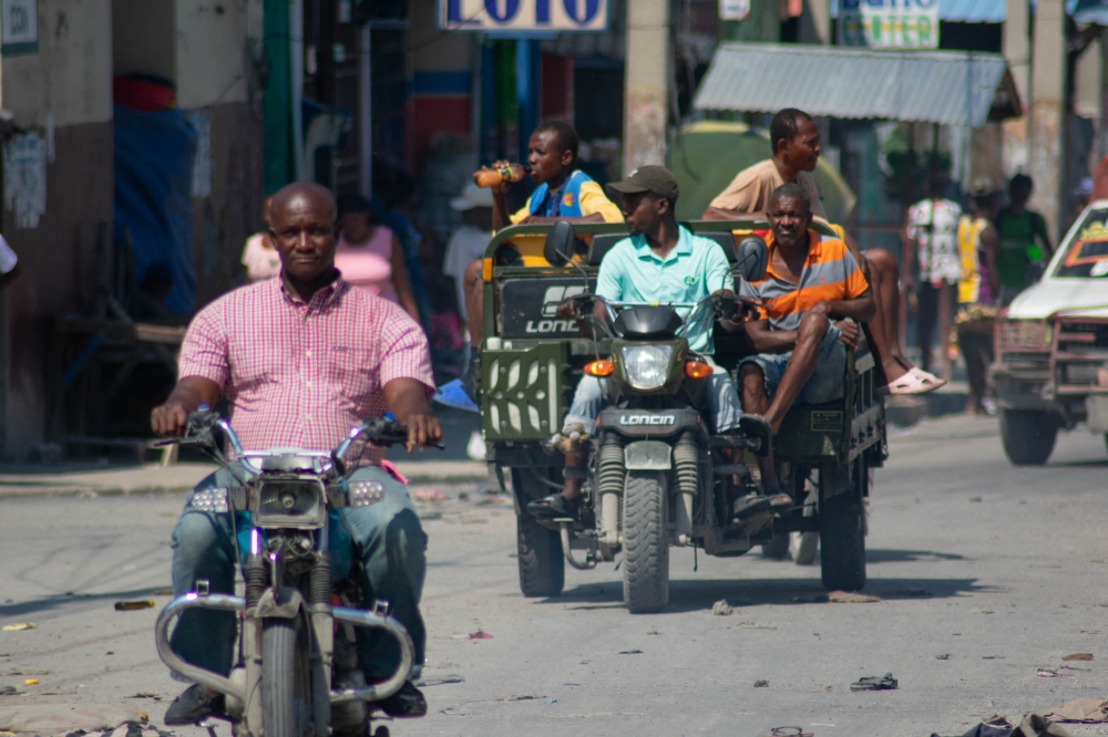 People drive their motorcycles in the street in Port-au-Prince, Haiti, on March 12, 2024. — AFP pic