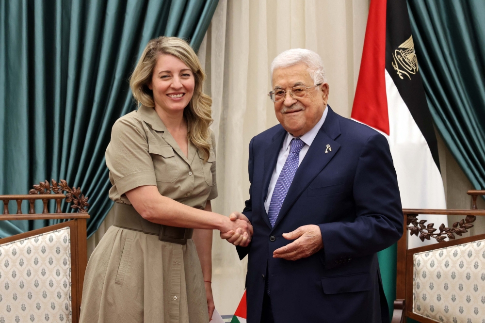 File photo of a handout picture provided by the Palestinian Authority’s press office (PPO), showing Palestinian President Mahmud Abbas (right) meeting with Canada’s Minister of Foreign Affairs Melanie Joly in Ramallah on March 12, 2024. — AFP pic