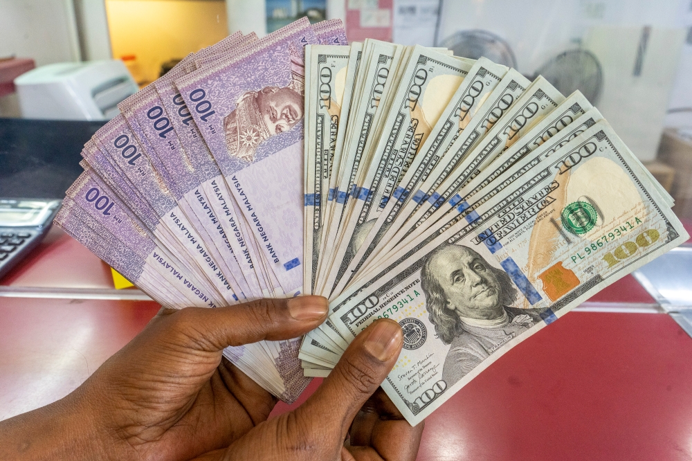 Yesterday, the ringgit was quoted at 4.7015 against the US dollar at 9am. and 4.7045 at 5pm, with an intraday high of 4.7075 in the onshore interbank market for ringgit, as published on the BNM website. — Picture by Shafwan Zaidon
