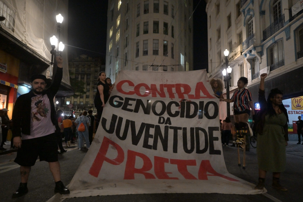 File photo of human rights activists protesting in front of the Secretariat of Public Security of Sao Paulo State against a police raid that killed 16 people in the cities of Guaruja and Santos, some 90 km from Sao Paulo, Brazil, on August 3, 2023. — AFP pic