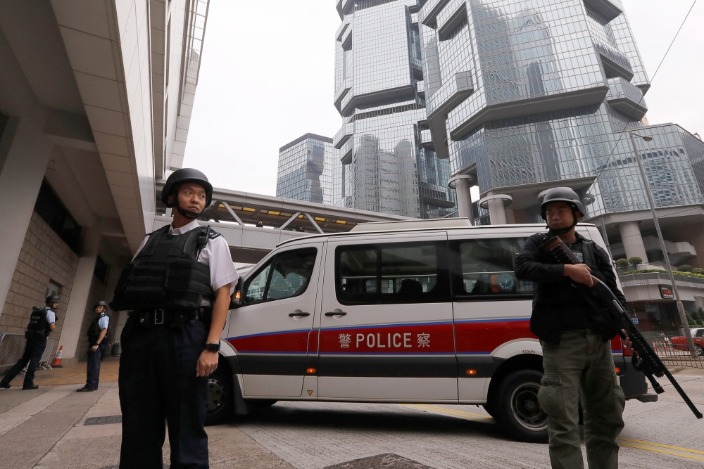 File photo of armed policemen standing guard at the entrance of the High Court in Hong Kong, China December 12, 2017. - Reuters pic
