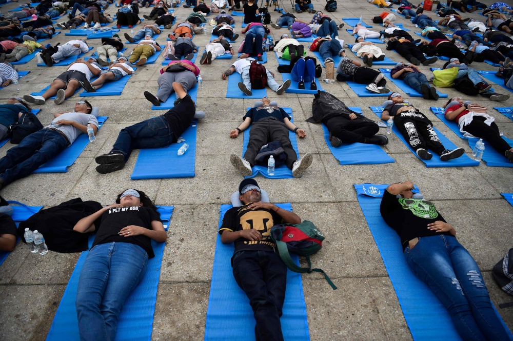 People enjoy a nap while attending the World Sleep Day event at the Monumento a la Revolucion in Mexico City, Mexico, on March 16, 2024. — AFP pic