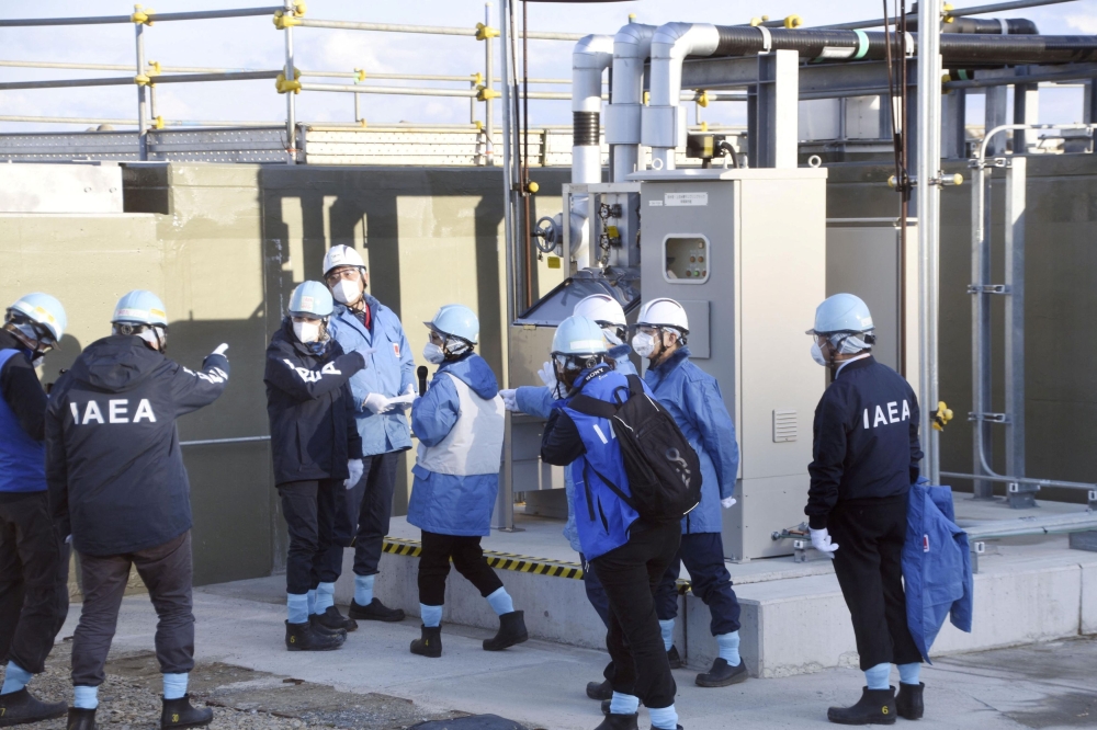 Officials, including International Atomic Energy Agency (IAEA) Director General Rafael Grossi, inspect the facility for sampling treated and diluted radioactive water at the tsunami-crippled Fukushima Daiichi nuclear power plant in Futaba town, Fukushima prefecture, Japan March 13, 2024. — Reuters pic/Kyodo
